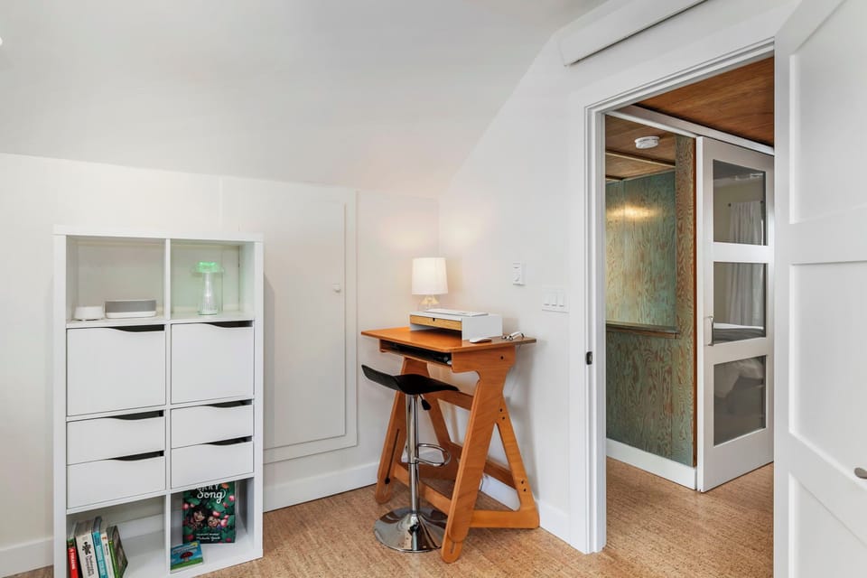 Work from vacation with our work station in this sunny upstairs office.