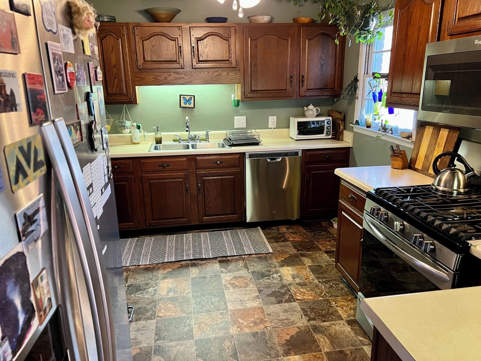 Full kitchen w/ propane stove, oven, microwave, dishwasher, toaster oven, etc.