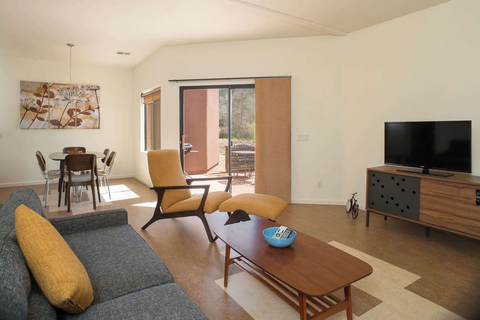 Open living and dining area with back patio entrance