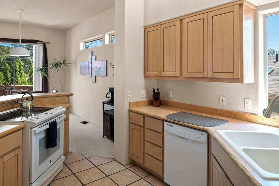 Fully stocked kitchen with coffee and microwave bar.
