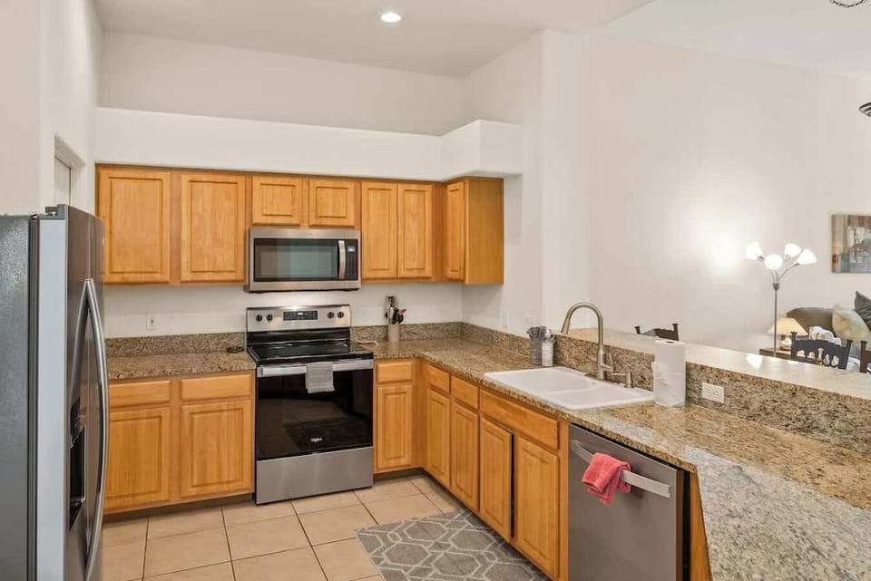 Fully equipped kitchen with granite countertops.