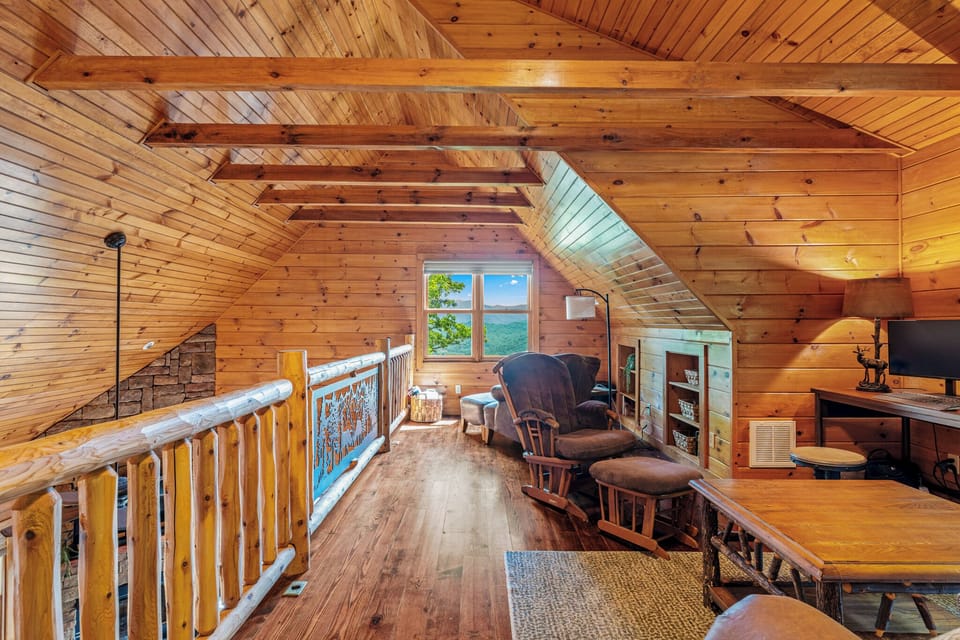 Loft with sitting area, work space, and queen sofa sleeper