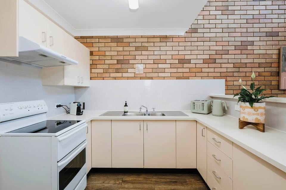 Create home-cooked meals in the well-equipped kitchen featuring an oven, Nespresso machine, and all the essentials for effortless meal prep.