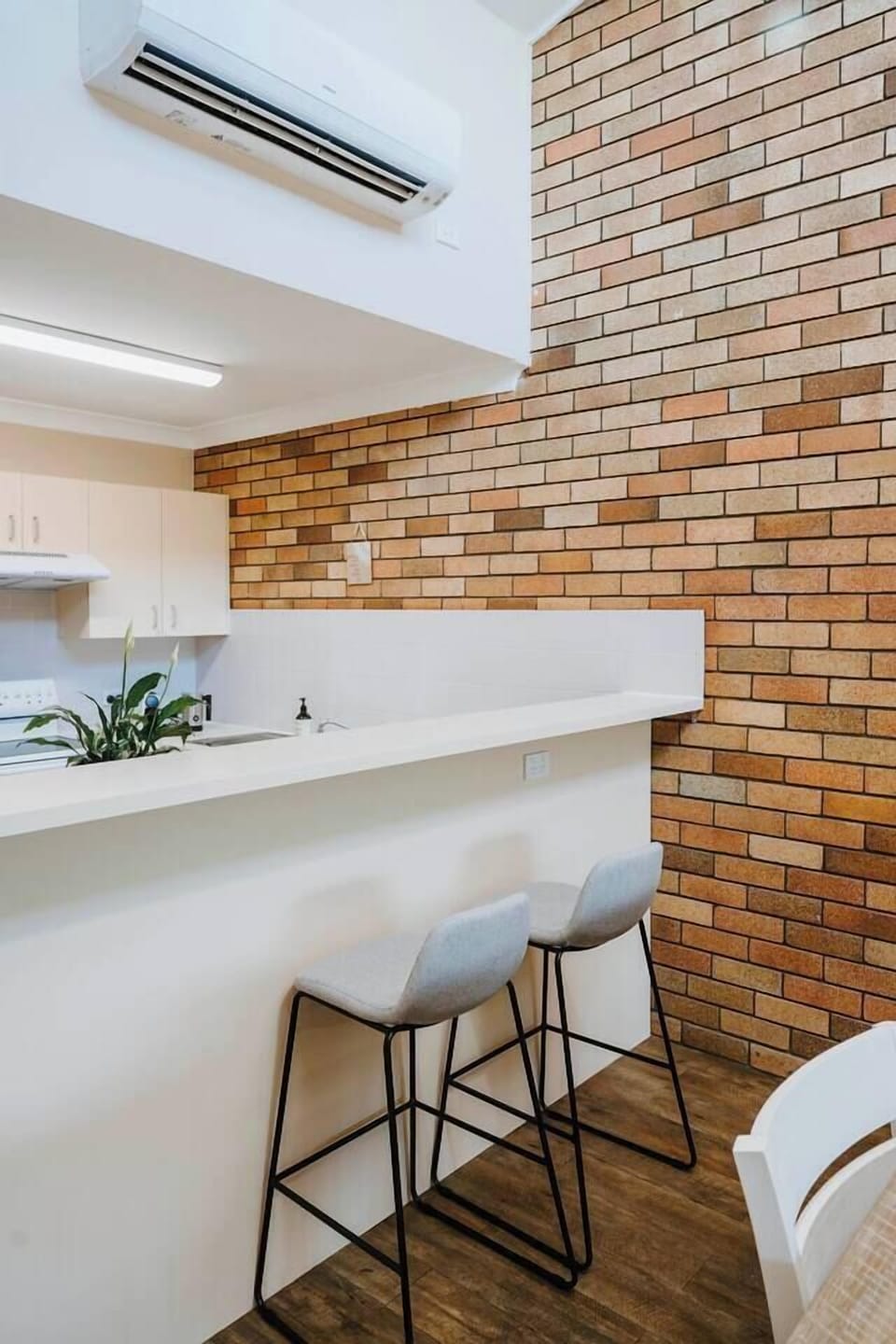 The breakfast bar offers a relaxed spot for morning coffee or quick bites.