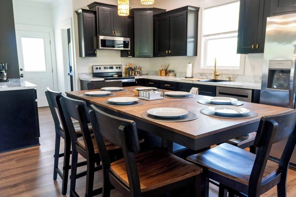 Eat in kitchen. With the counter height table, you can use the table for food prep, then when it's time to eat, the table seats up to 8 people with stools and a bench. A baby high chair is also available for use.