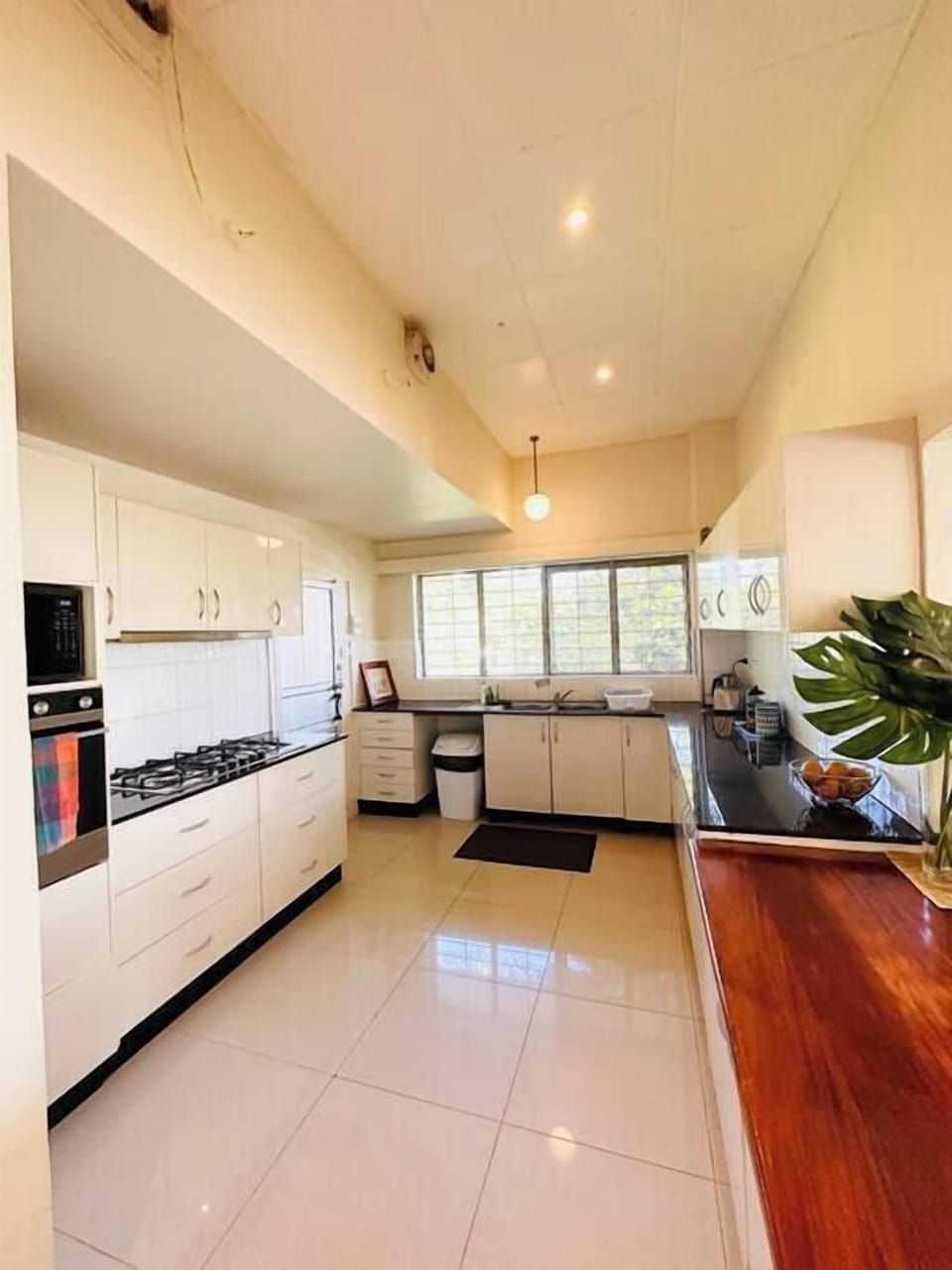 Kitchen with 6 Burner Gas Stove, Wall oven and Microwave oven