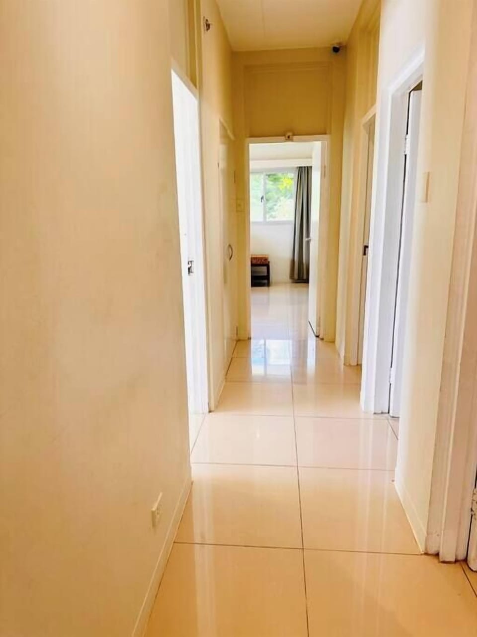 Hallway to 3 bedrooms/Bathroom and toilets