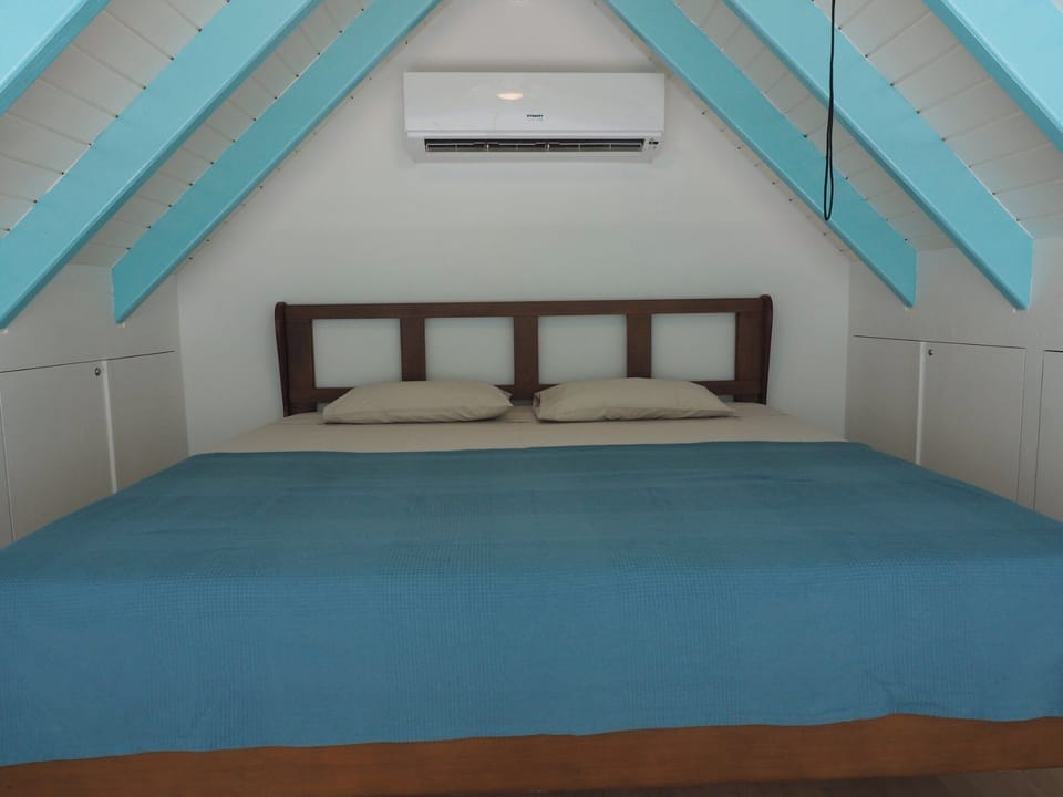 Loft with king sized bed and its own AC.