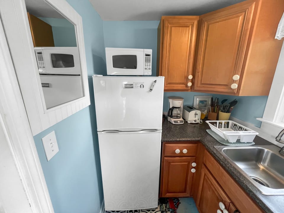 Kitchen with stove/oven, microwave and  fridge