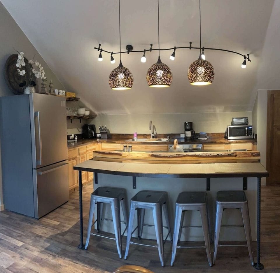 Full kitchen in open floor plan with living room and dining area