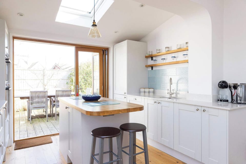 Our modern kitchen offers a great space for cooking and casual dining, with direct access to the outdoor patio.