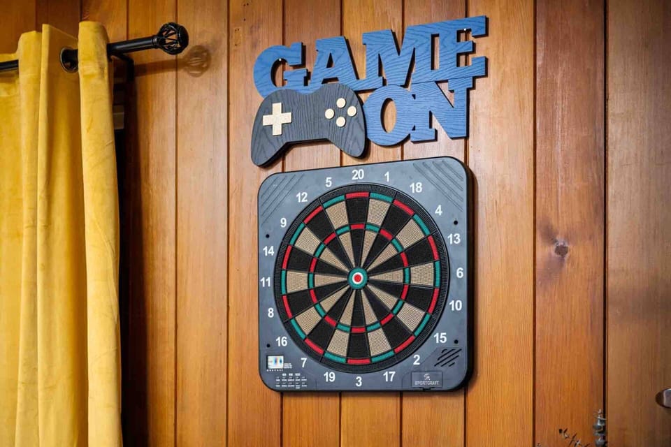 Play a game of darts in the game room.