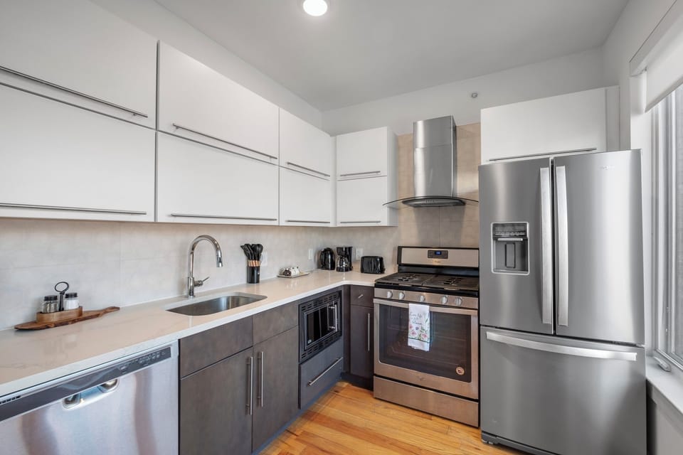 Complete kitchenette with full-size refrigerator, oven, microwave, and dishwasher.