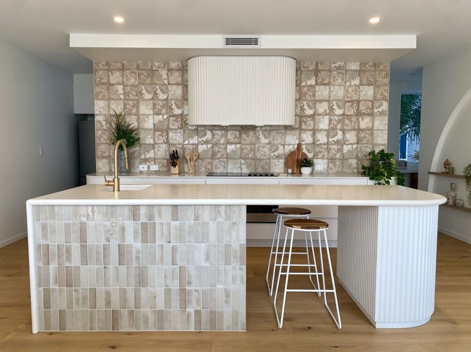 Designer kitchen the centrepiece of entertainment to the dining and lounge.