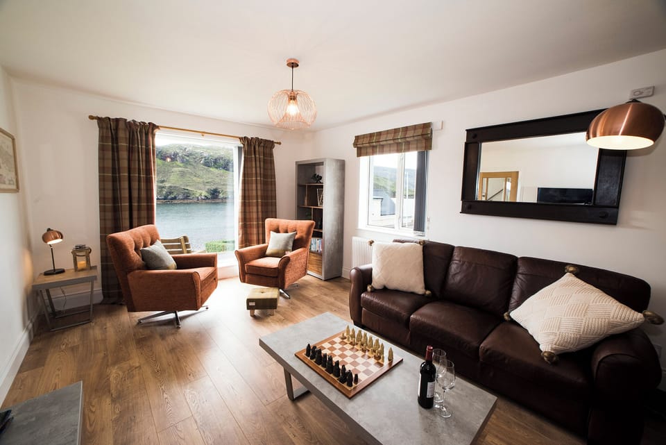 Living Room with a view over  West Loch and a Real Flame Fire to cosy up to.