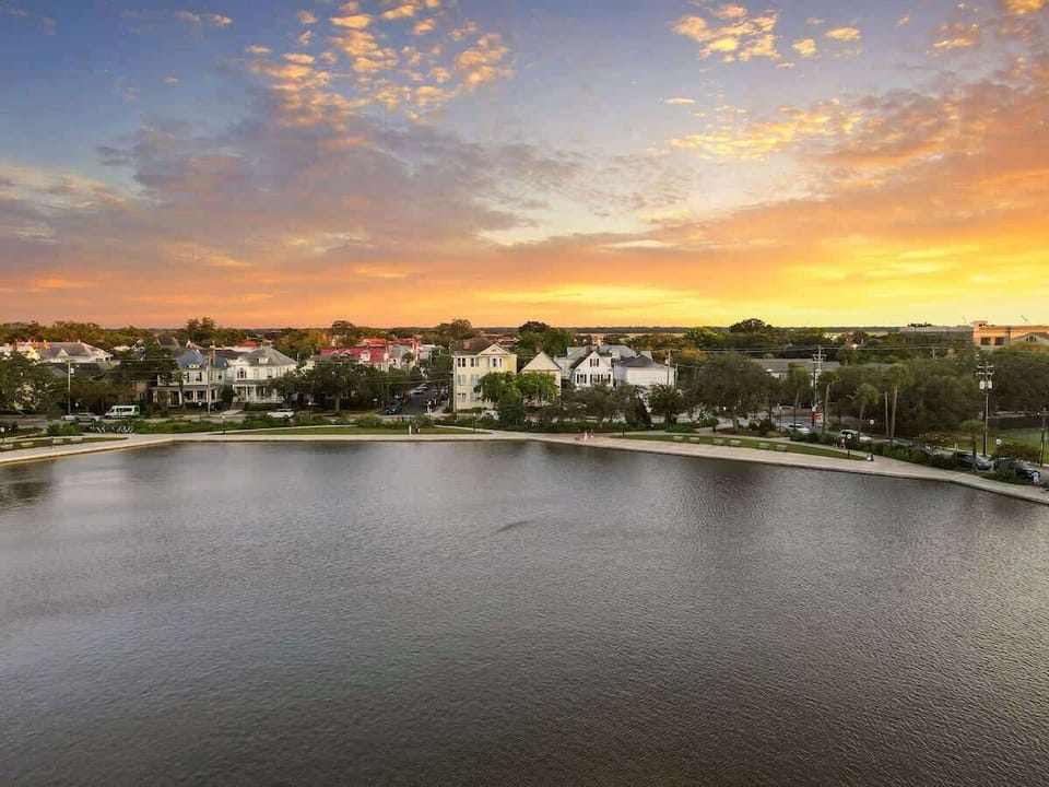 Soak in postcard-perfect sunsets over Colonial Lake, just steps from your front door. A peaceful, walkable location in the heart of Charleston’s historic charm—this view never gets old.