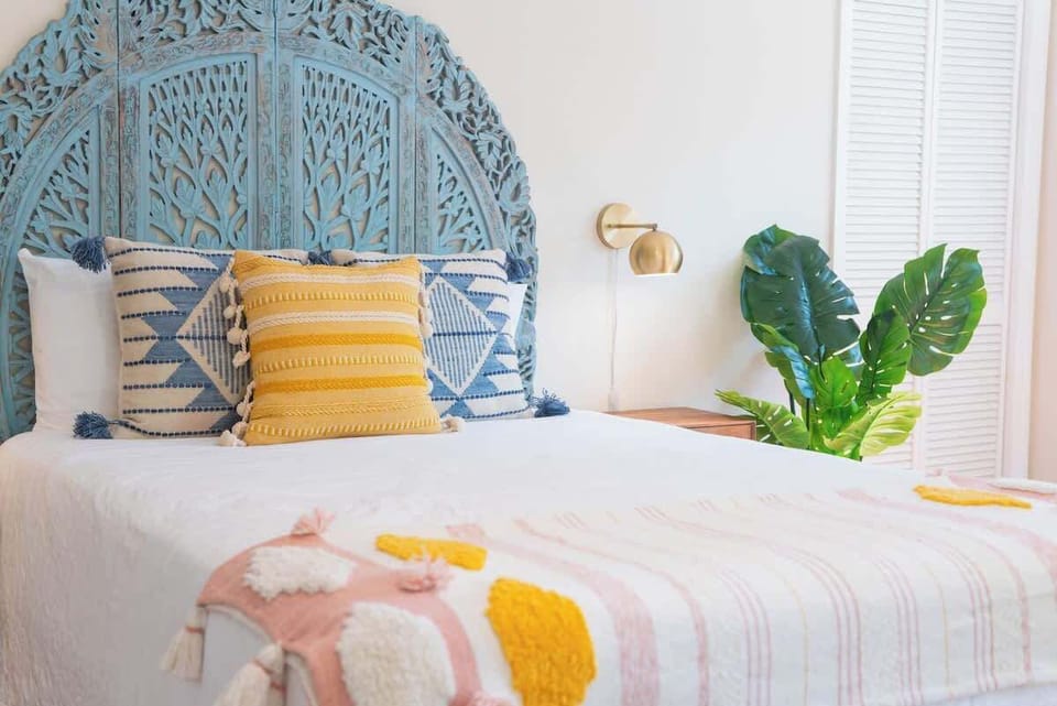 Downstairs bedroom with queen bed and private outdoor entrance