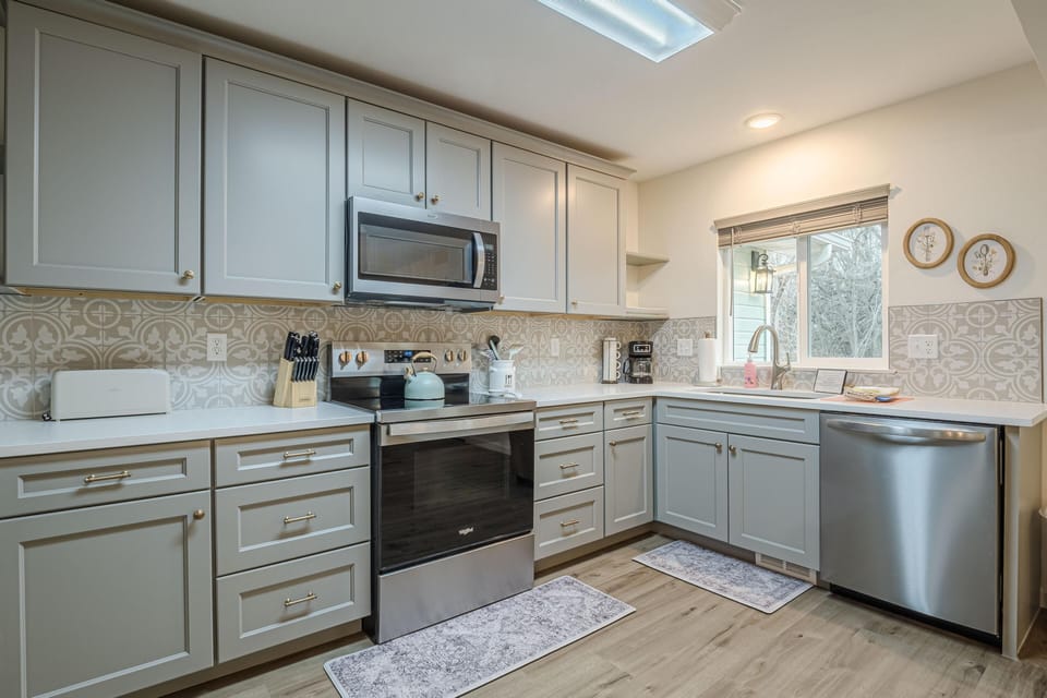Stainless steel appliances seamlessly blend modern convenience into this dreamy kitchen.
