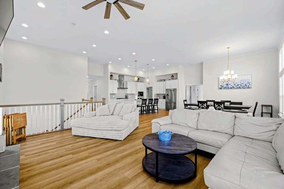 Great Room - Sectional and lounger flow straight into kitchen and dining, so the gathering never gets split between rooms.