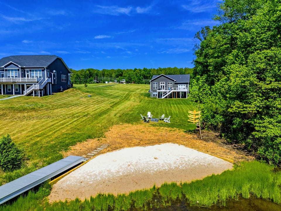 Backyard & Beach - Soft sand at the lake's edge, Adirondacks in the grass, kayaks at the ready before the day even starts.
