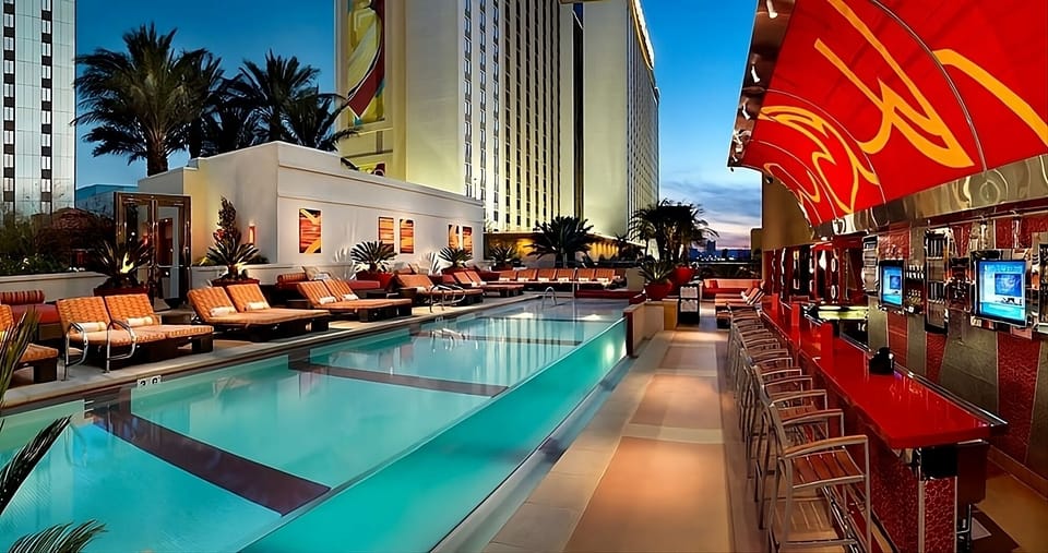 Sip cocktails poolside as the city lights start glowing.