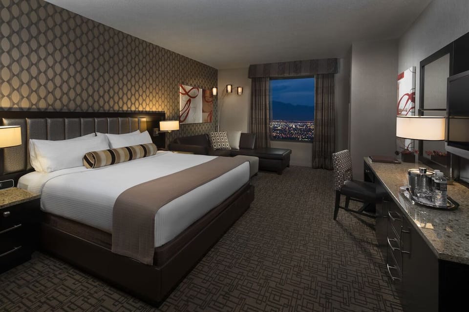 Settle in comfortably with roomy bed, desk, and lounge corner.