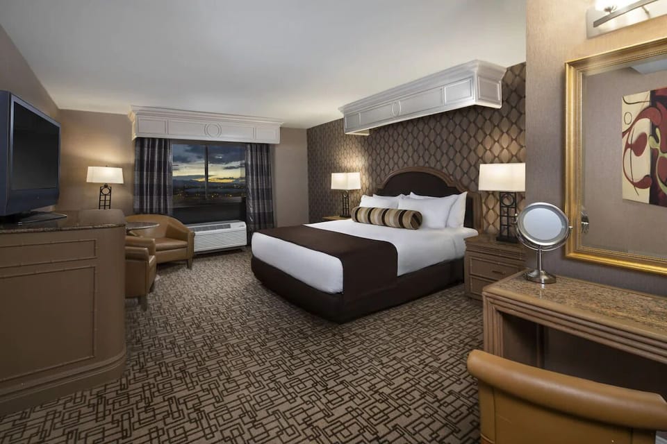 Settle in comfortably with roomy bed, desk, and lounge corner.