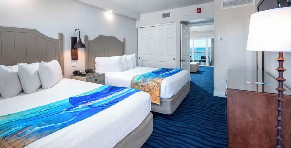 Relax in a spacious room with soothing ocean-blue accents.
