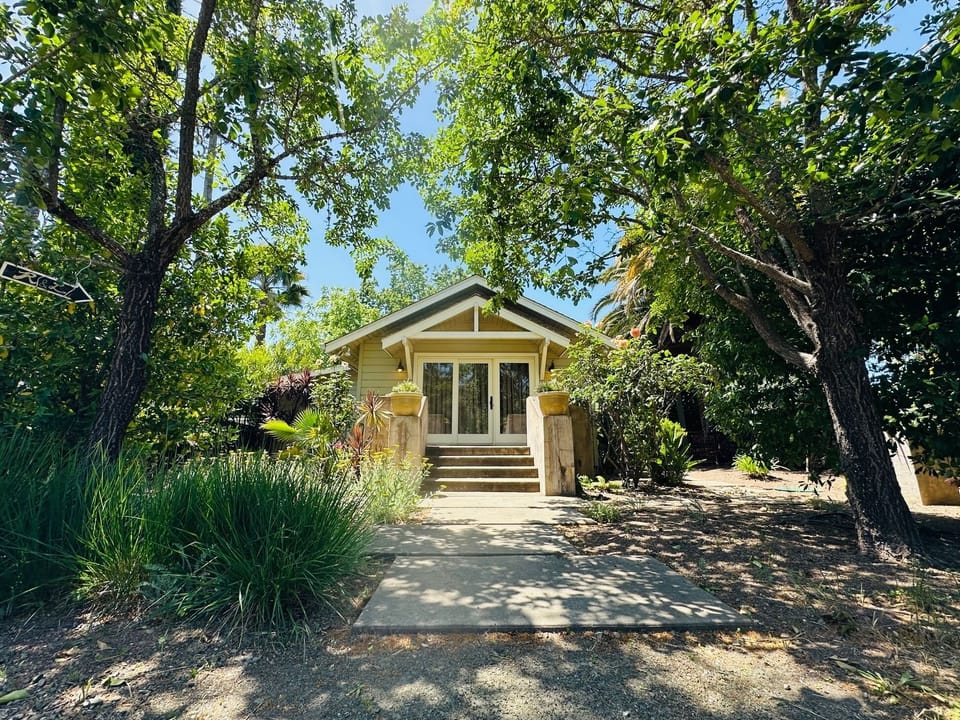 Myrtledale Bungalow is tucked among mature trees and thoughtful landscaping.