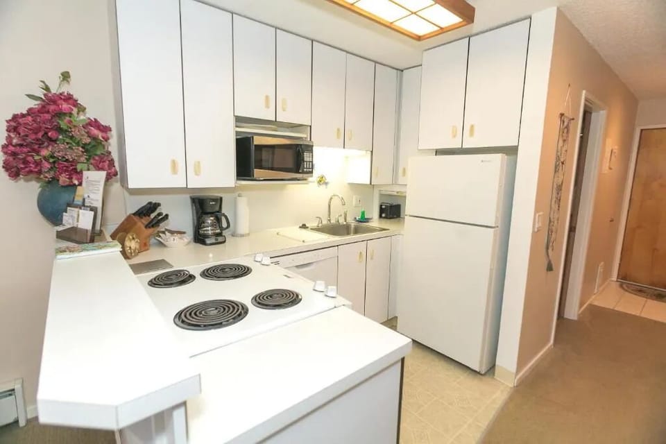 Cook easy meals with full appliances and bright counters.