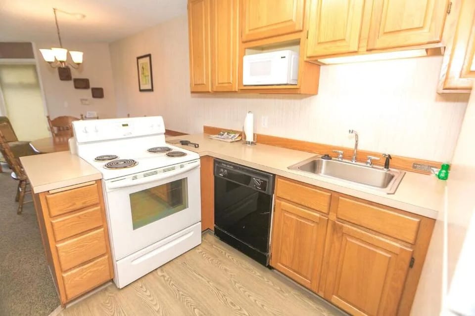 Cook simple meals easily with a full kitchen and fridge.