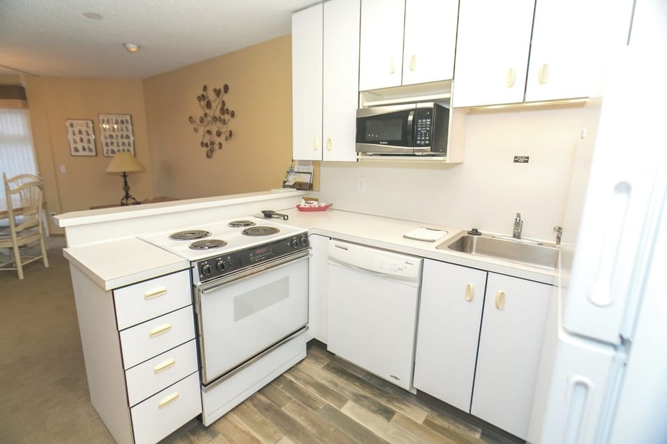 Cook simple meals with full-size fridge, microwave, and stovetop.