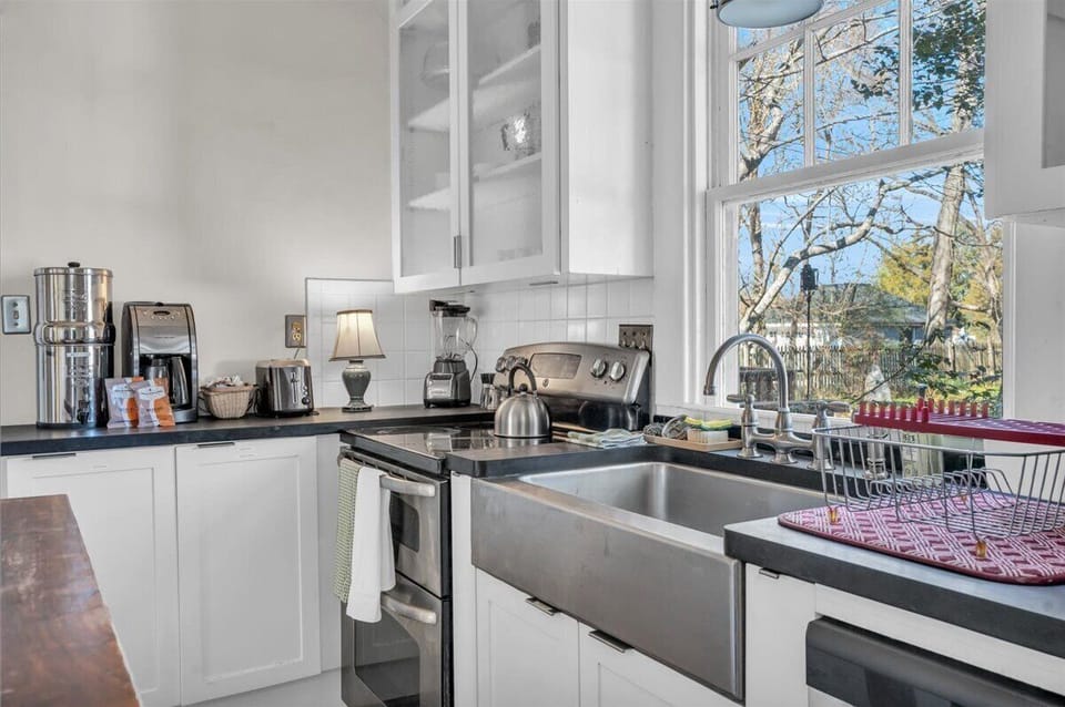 Kitchen: Bright and airy space with modern appliances and lovely backyard views! Get cooking!