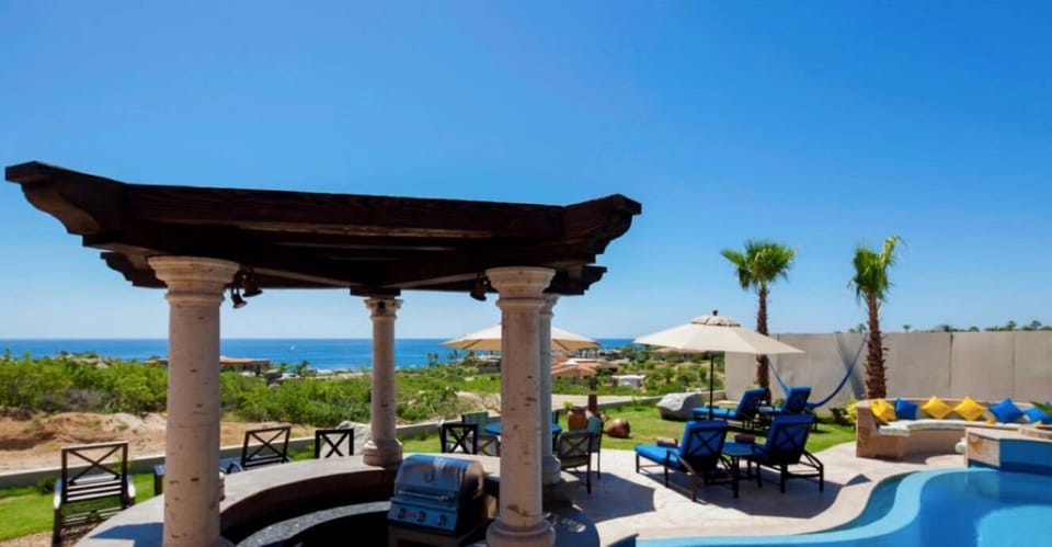 Swim Up Bar with outdoor Kitchen Barbecue Pit and Refrigerator. 