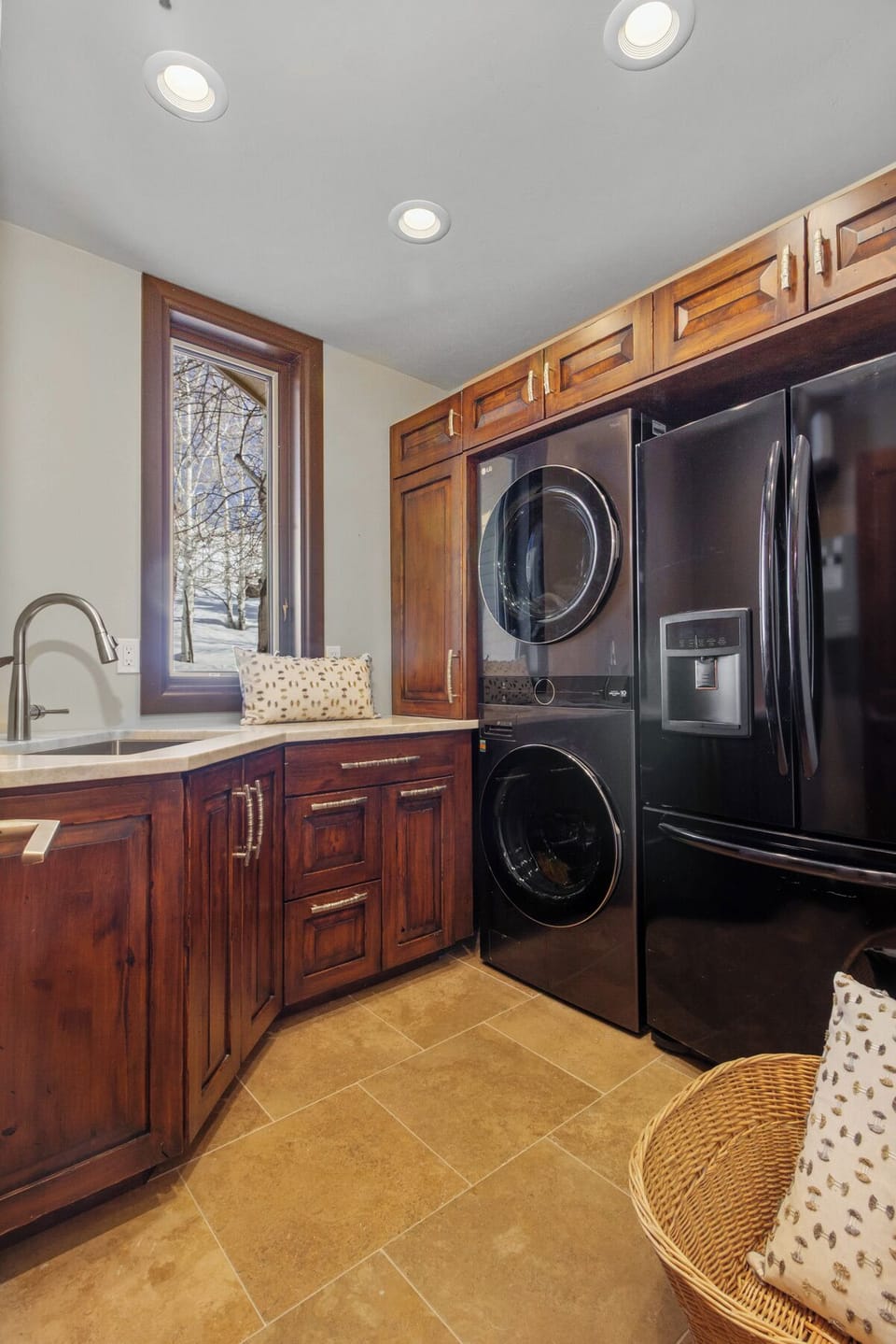 Laundry conveniently located on the main floor includes an extra frig w/freezer.