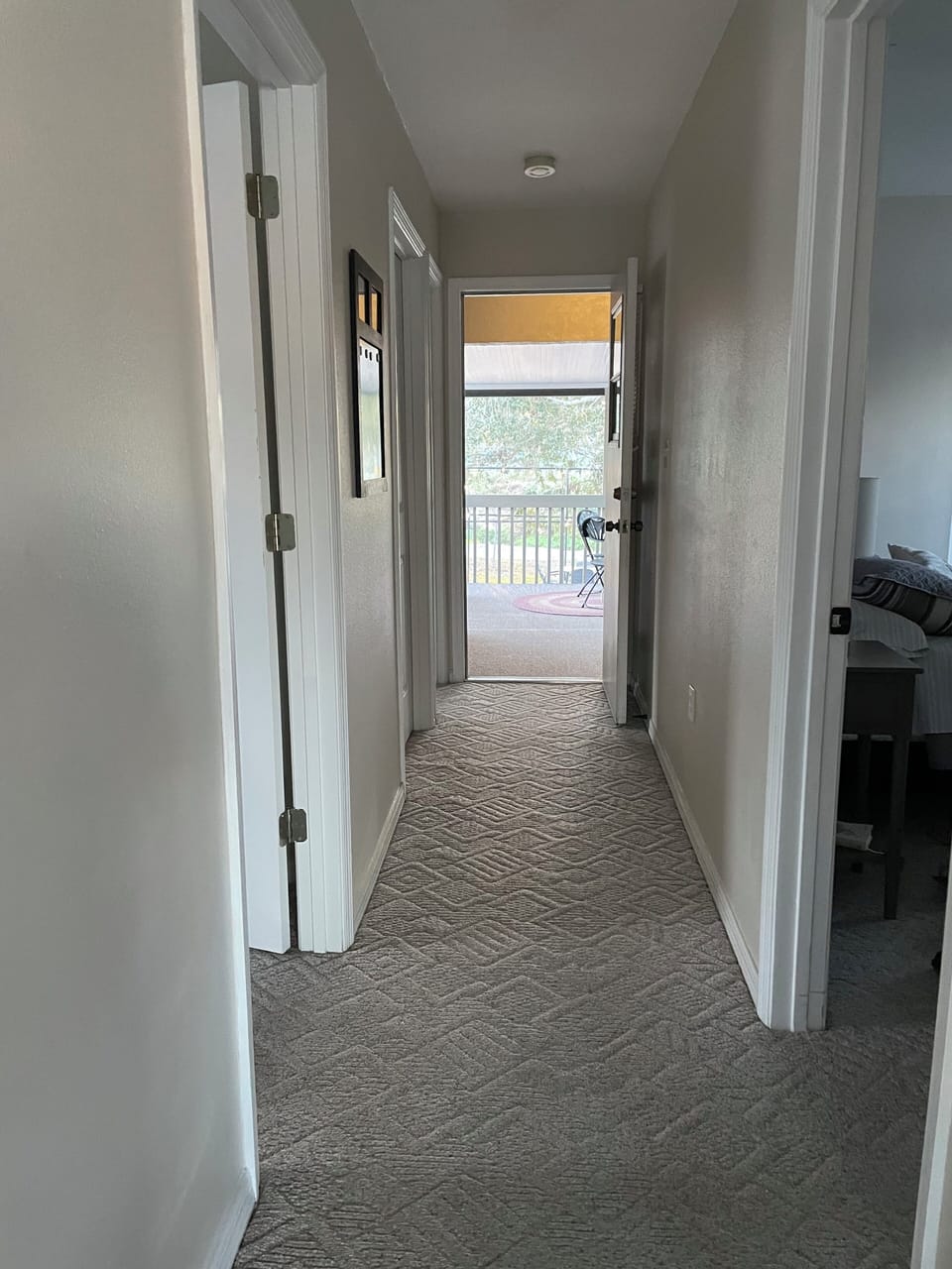 Hallway to Bedrooms and door to lanai