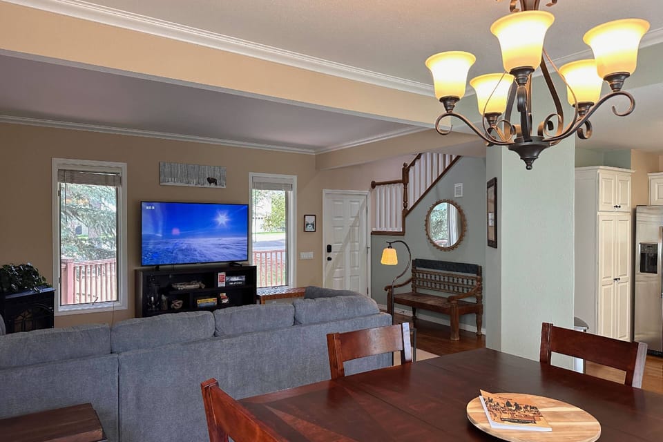 Streaming is a breeze w/ Starlink internet! Make yourself at home on this large sectional sleeper sofa and open concept living and dining room.