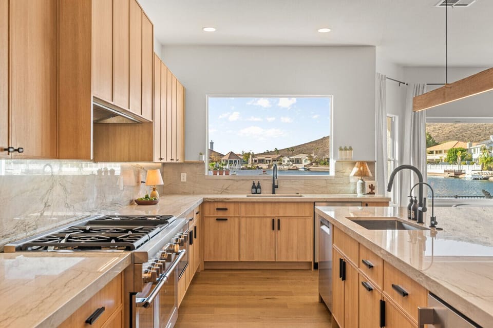 Brand new chef`s kitchen with 42` Thermidor 8-burner gas range with double oven, two sinks, two dishwashers and plenty of prep space with beautiful views out to the lakes and surrounding mountains!