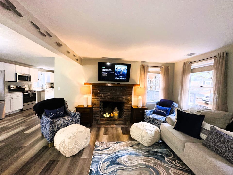 Living room with plenty of seating and beautiful coastal design