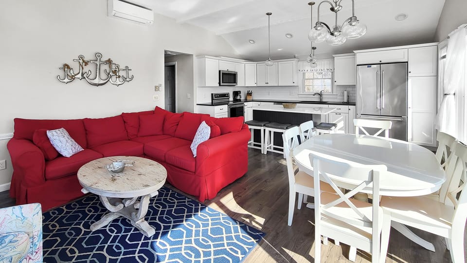Living room and dining area with kitchen beyond