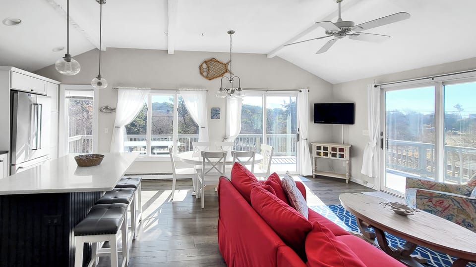 Second floor main living area is open and brigth with a vault ceiling