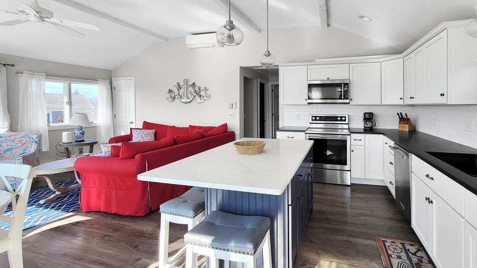 Kitchen with dining area and living room beyond