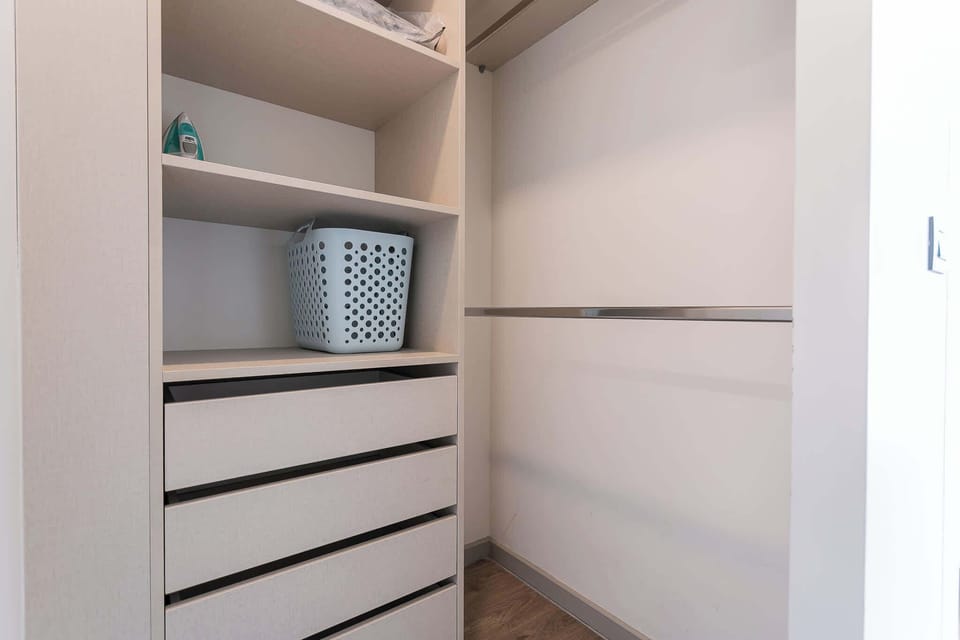 Spacious closet with ample storage and shelving, perfect for organizing your belongings during your stay.