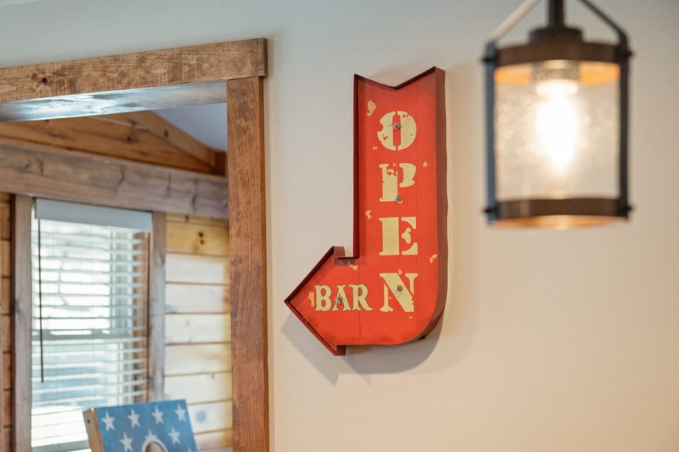 Bar is Open
Fun details like this wall sign set the tone for a laid-back, good-vibes-only getaway.