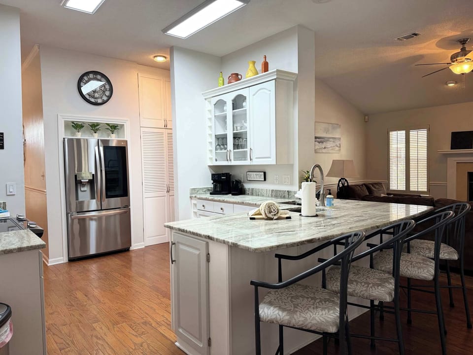 Fully stocked kitchen with breakfast bar