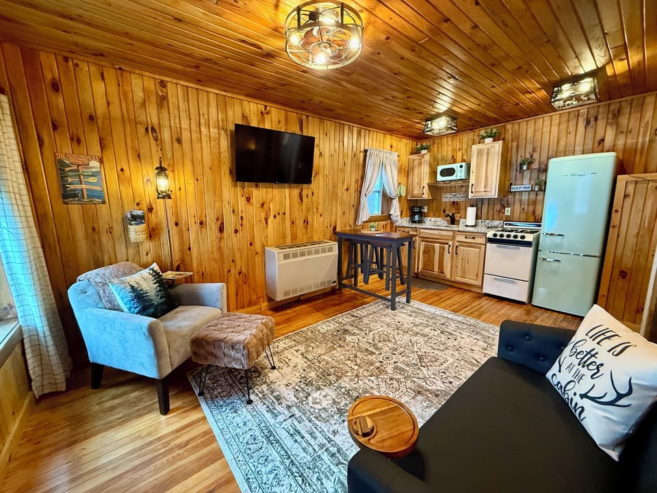 View from the bedroom area into the living room/kitchen space.