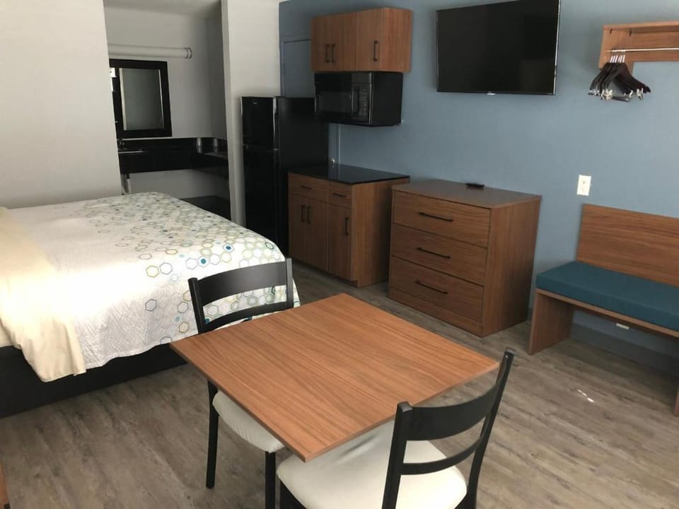 Kick back with wall-mounted TV and cozy in-room dining.