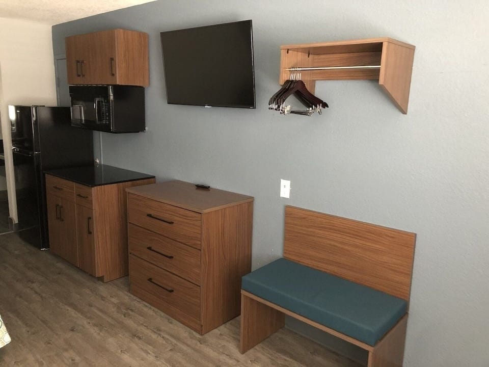 Store snacks and essentials with ample cabinetry and mini fridge.