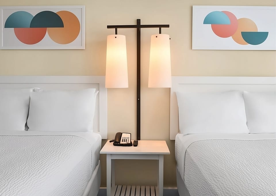 Recharge bedside with warm lighting and easy nightstand access.
