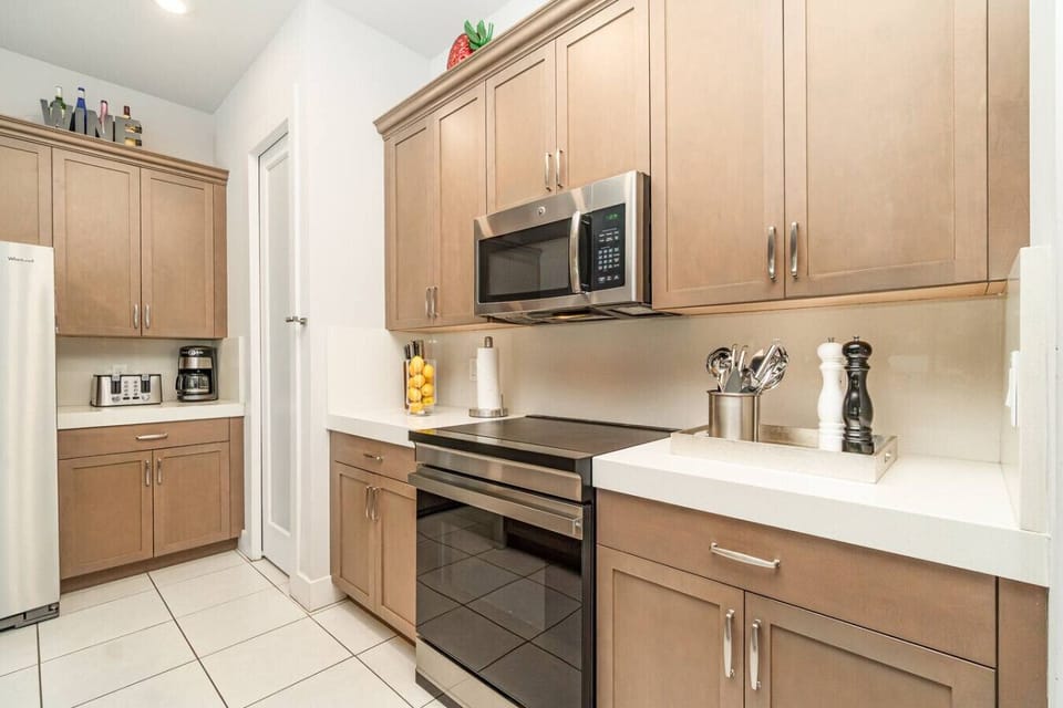 Fully equipped modern kitchen with stainless steel appliances, perfect for preparing family meals.